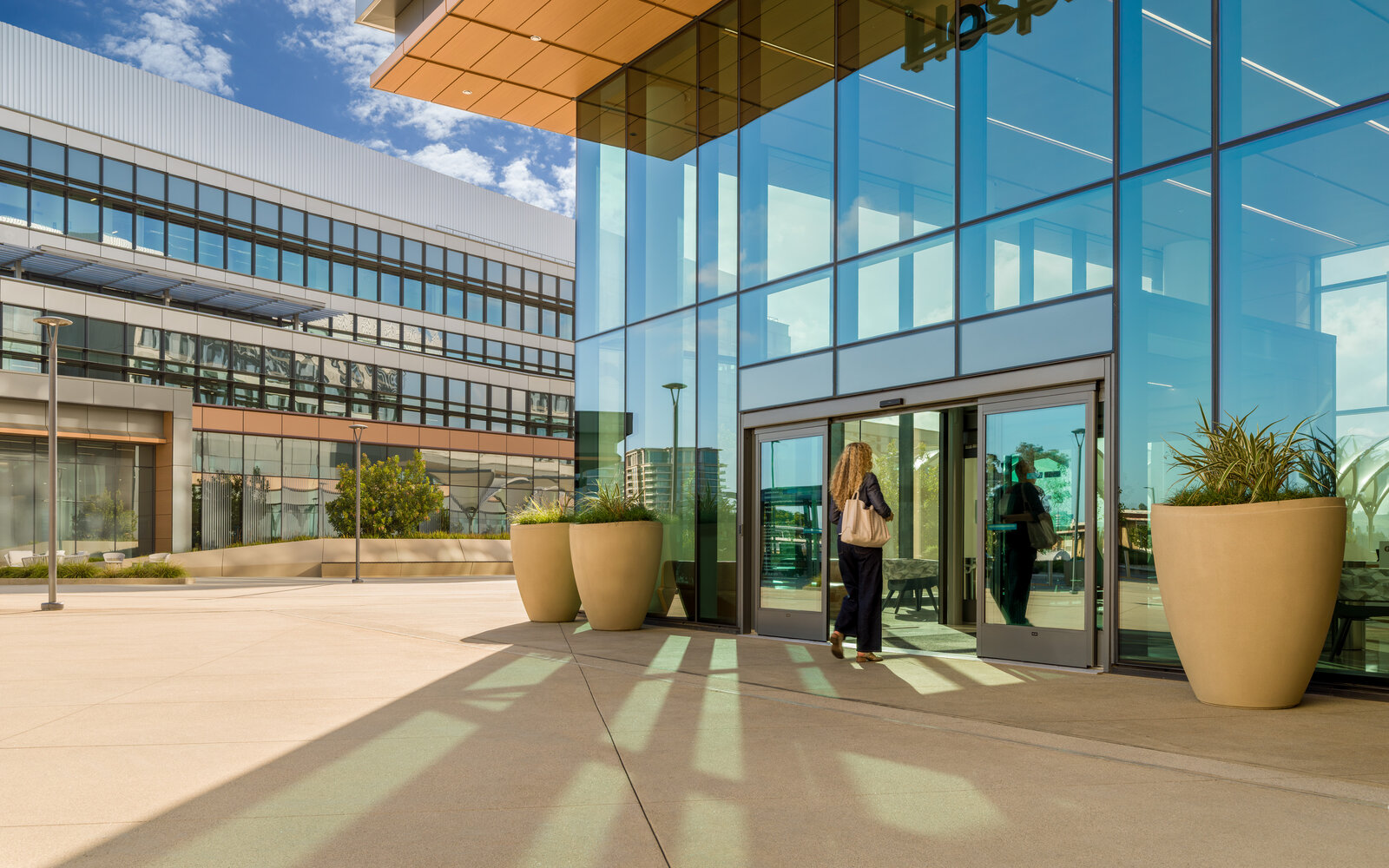 UCI Health hospital entrance with figure